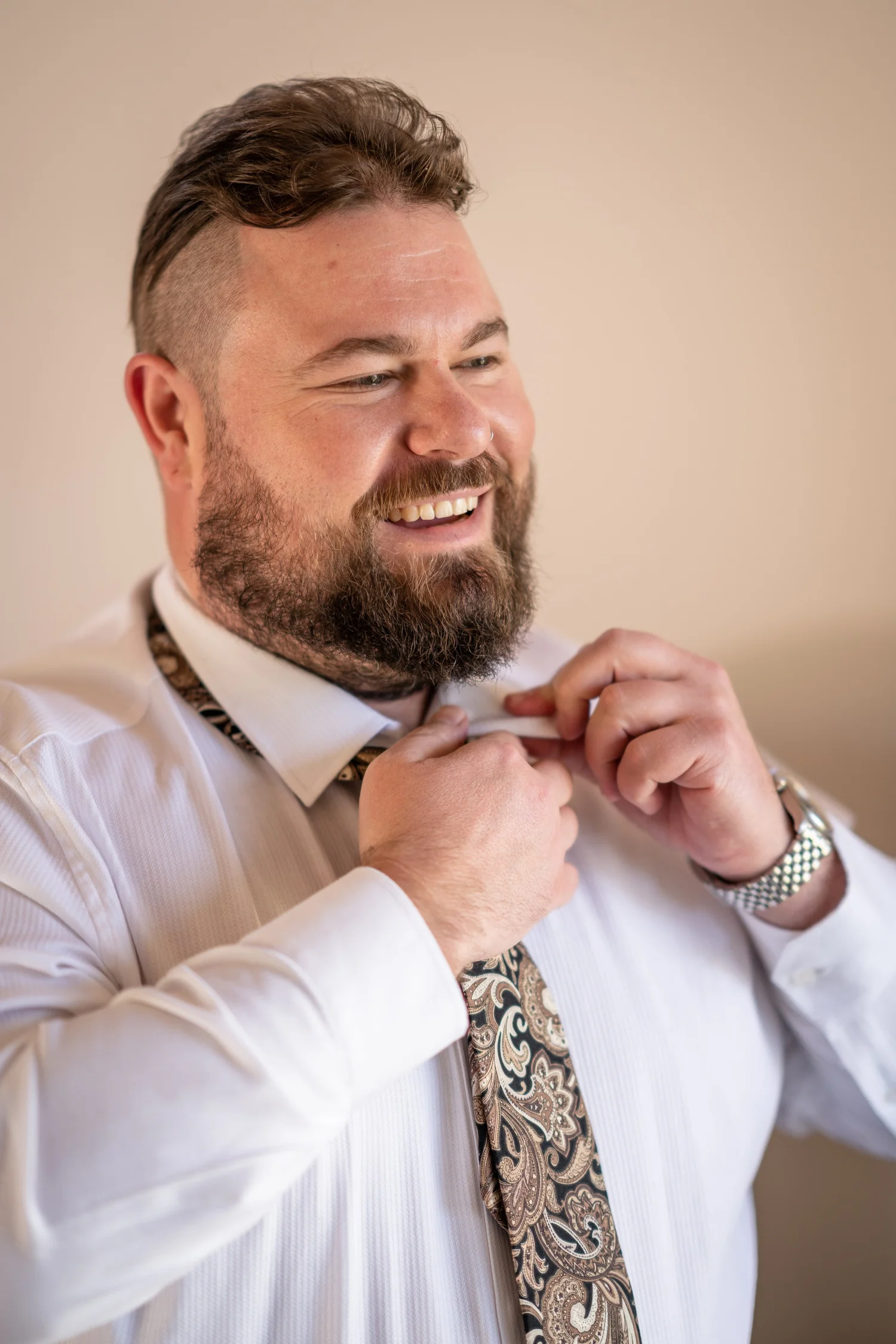 Doing up a tie. Lauren & Matt's wedding at Wandin Estate, Hunter Valley