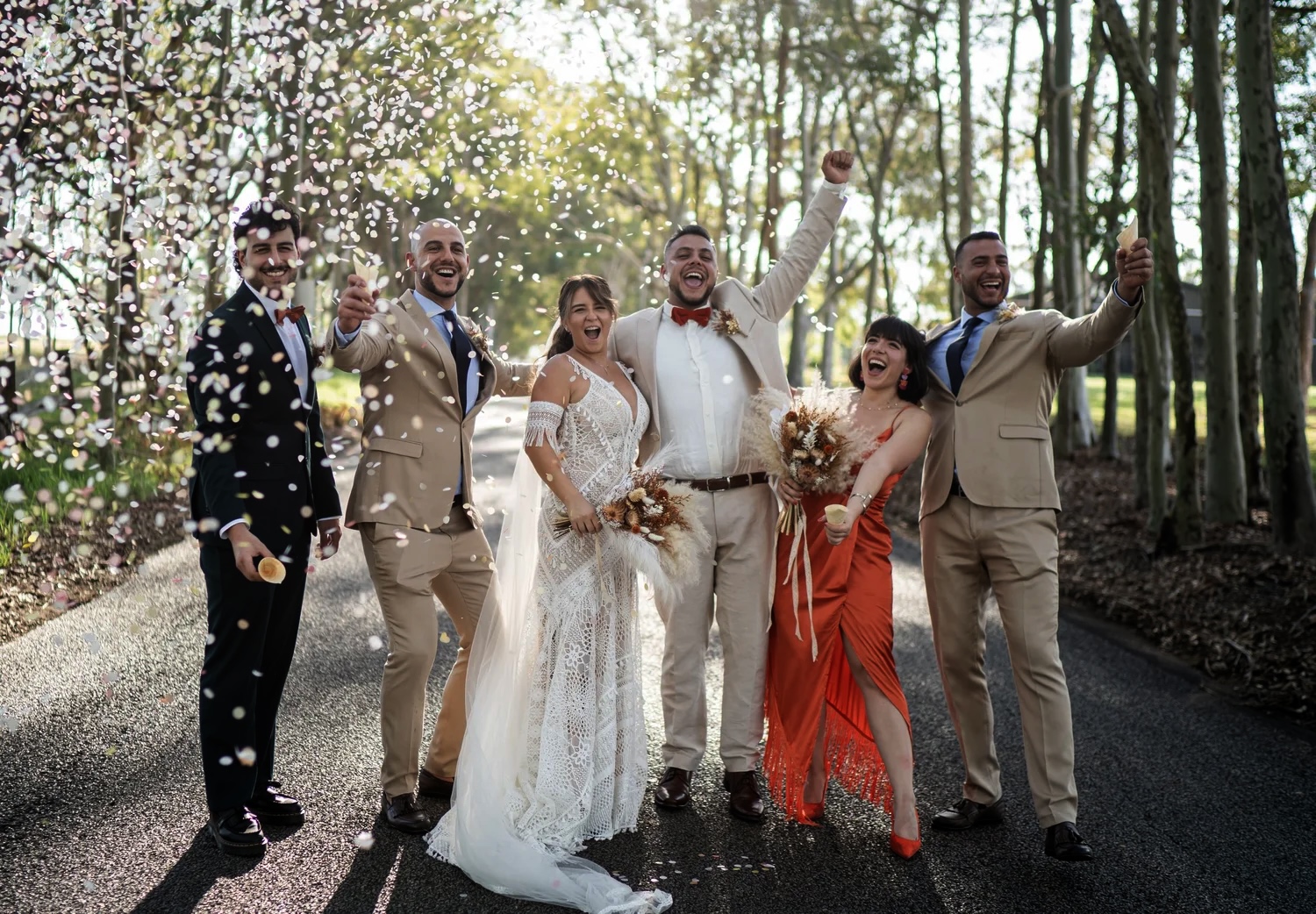 The wedding party on a tree-lined drive. Naz & Nadeem's wedding at Palmers Lane on Vineyard, Hunter Valley