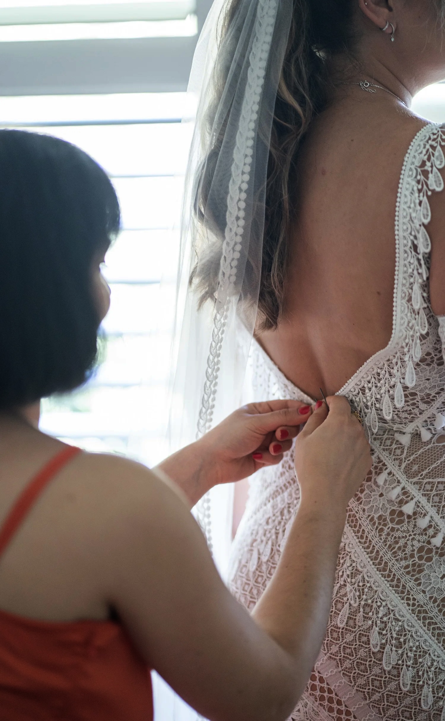 Doing up the dress. Naz & Nadeem's wedding at Palmers Lane on Vineyard, Hunter Valley