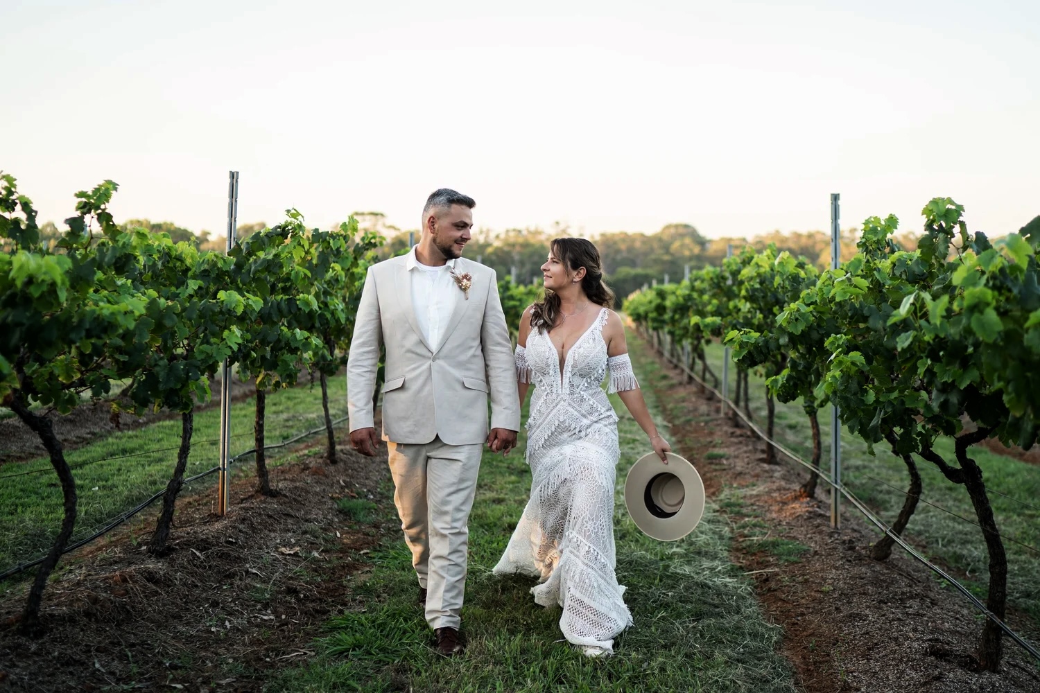 Walking through the vineyard. Naz & Nadeem's wedding at Palmers Lane on Vineyard, Hunter Valley