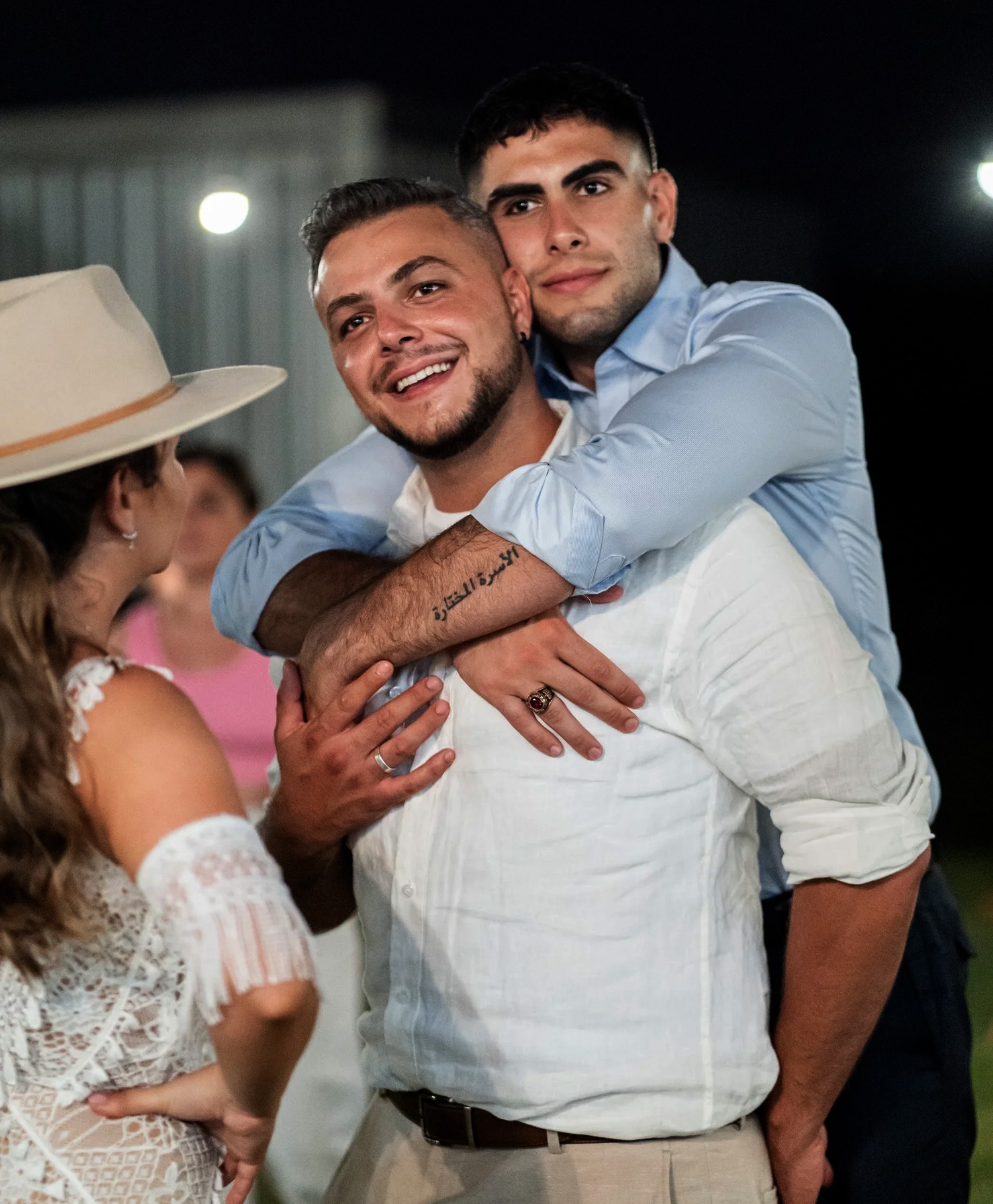 Friends hugging at the reception. Naz & Nadeem's wedding at Palmers Lane on Vineyard, Hunter Valley