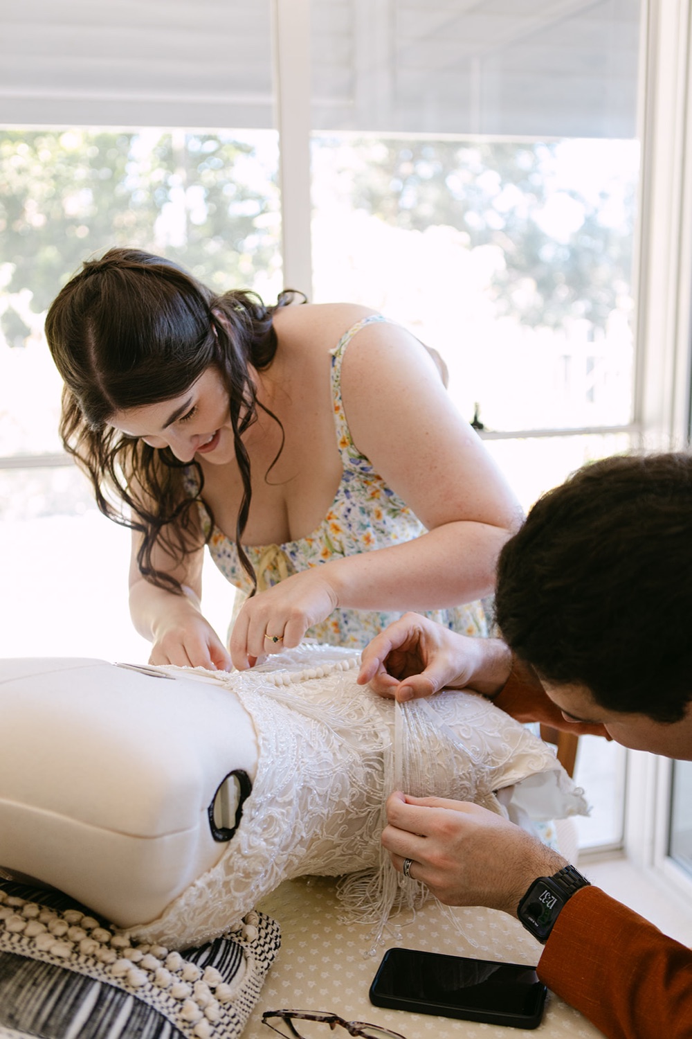 Getting ready at the table. Phoebe & Cameron's wedding at Curzon Hall, Sydney
