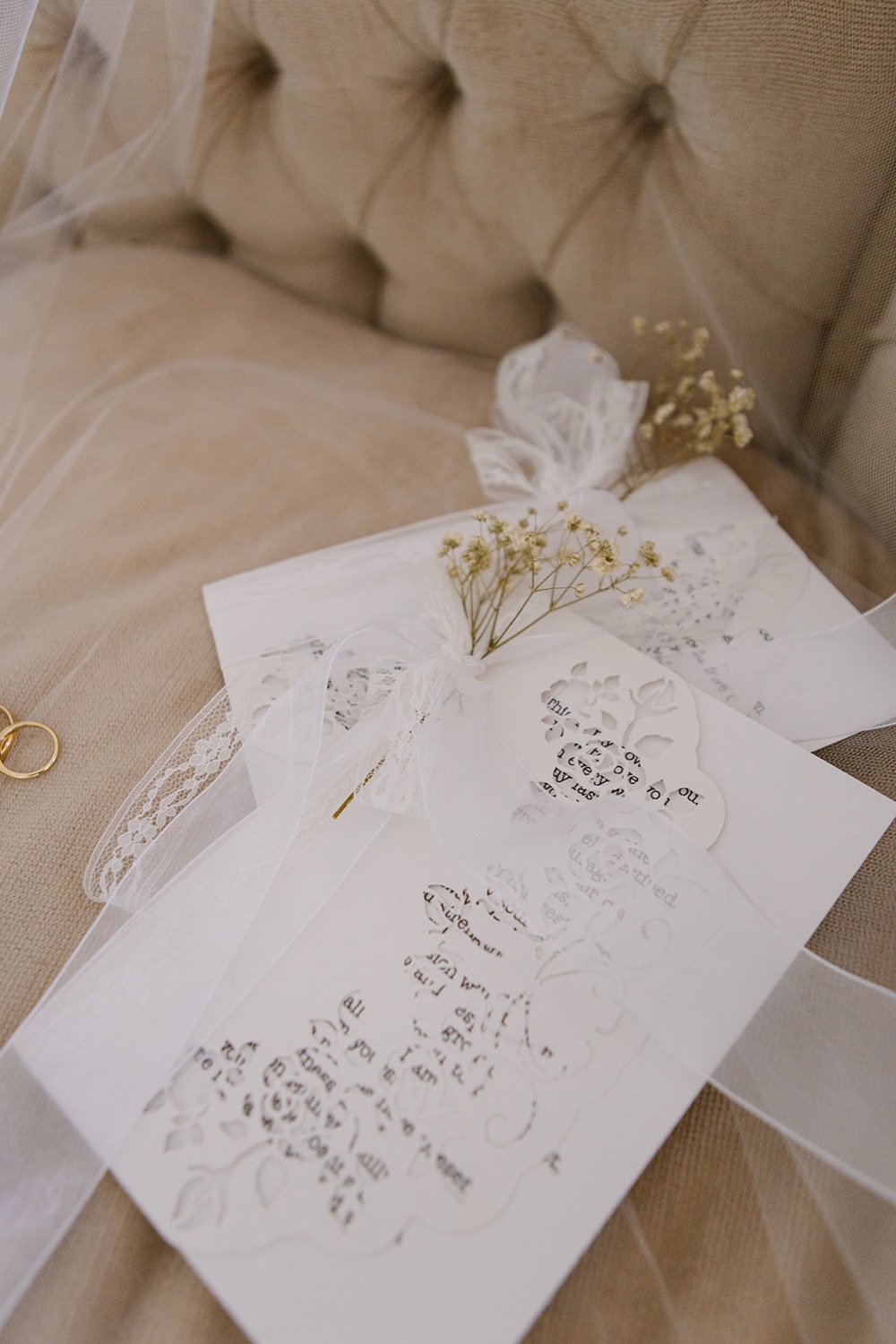 Wedding stationery on the sofa. Phoebe & Cameron's wedding at Curzon Hall, Sydney