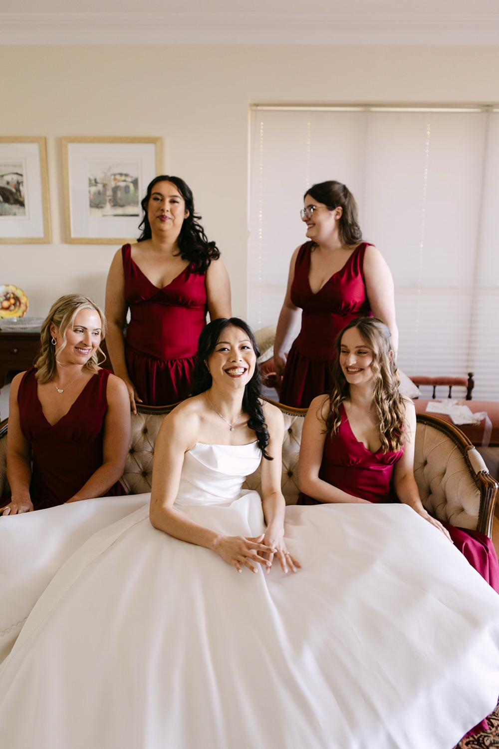 The wedding party in red dresses. Phoebe & Cameron's wedding at Curzon Hall, Sydney