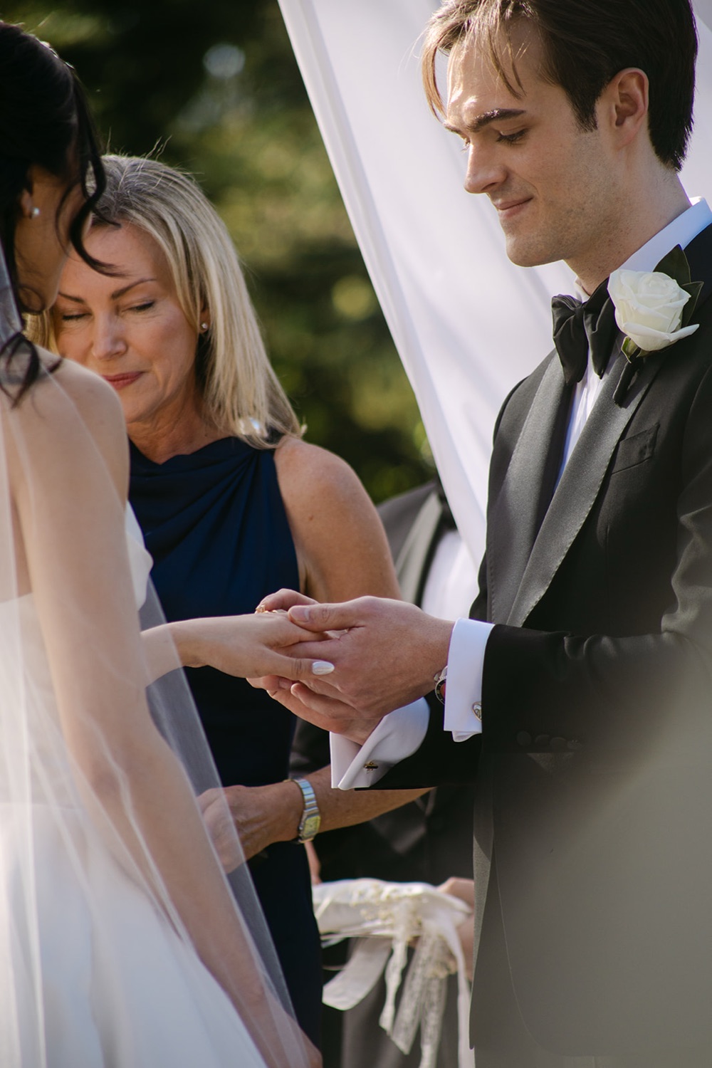 Rings during the ceremony. Phoebe & Cameron's wedding at Curzon Hall, Sydney