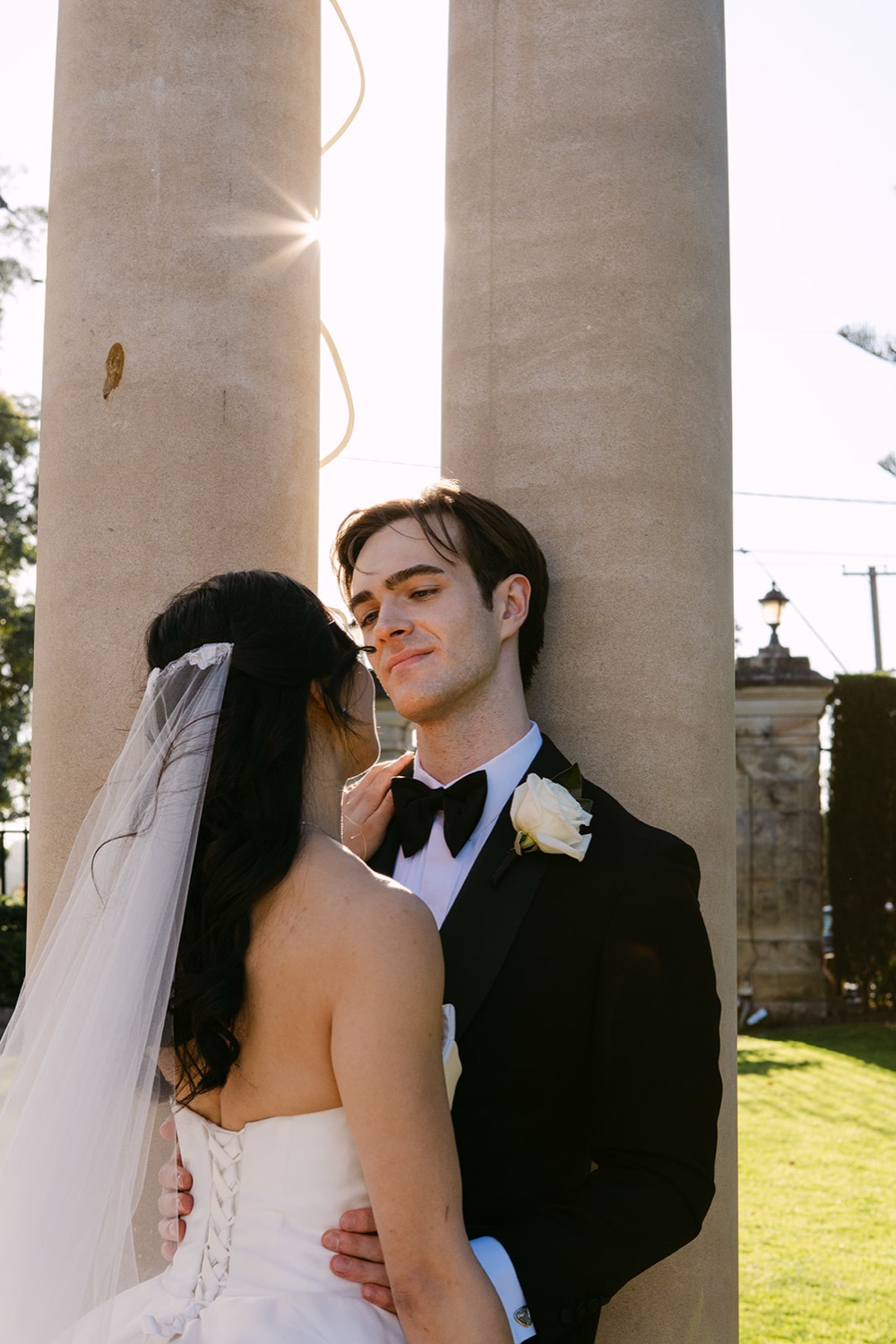 A close portrait by the columns. Phoebe & Cameron's wedding at Curzon Hall, Sydney