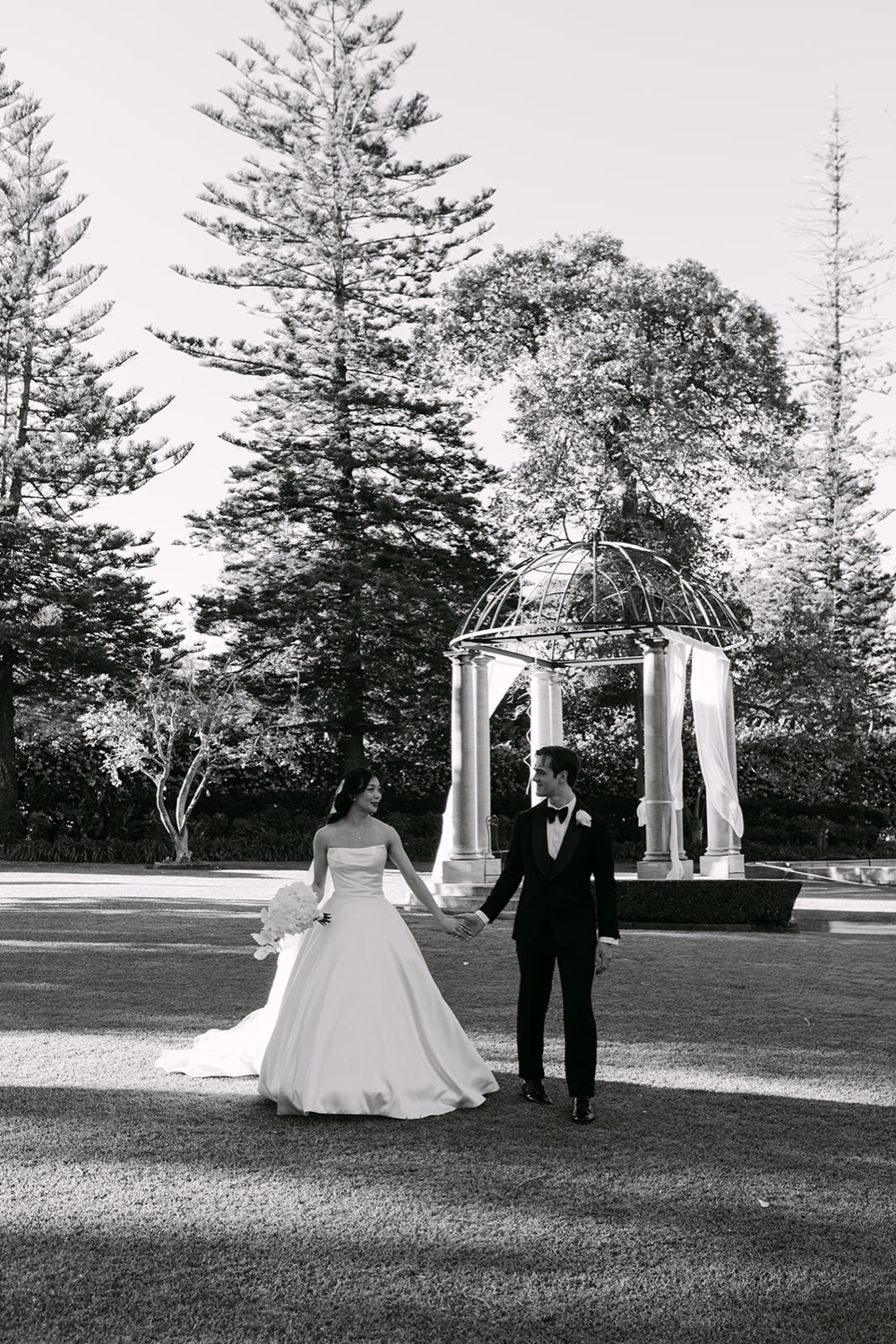 The couple on the lawn, in black and white. Phoebe & Cameron's wedding at Curzon Hall, Sydney