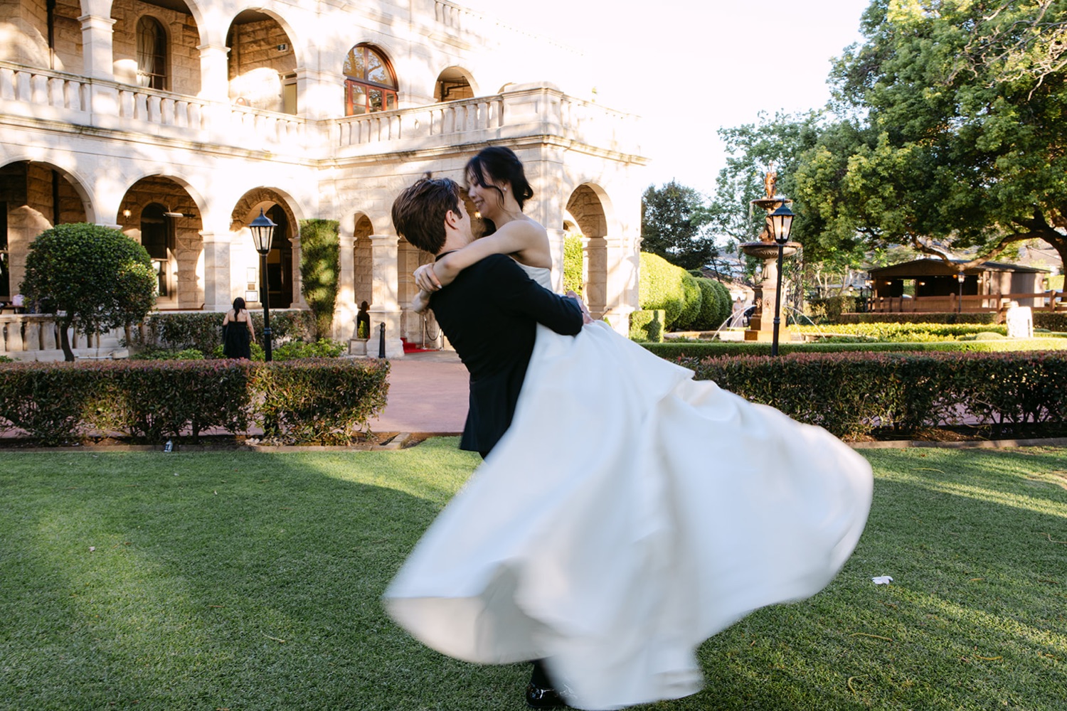 A twirl on the lawn in front of the hall. Phoebe & Cameron's wedding at Curzon Hall, Sydney