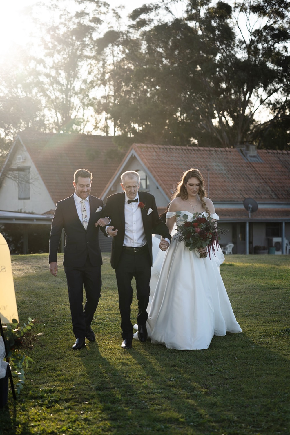 Walking down the aisle with family. Sarah & Alex's wedding at Wandin Estate, Hunter Valley
