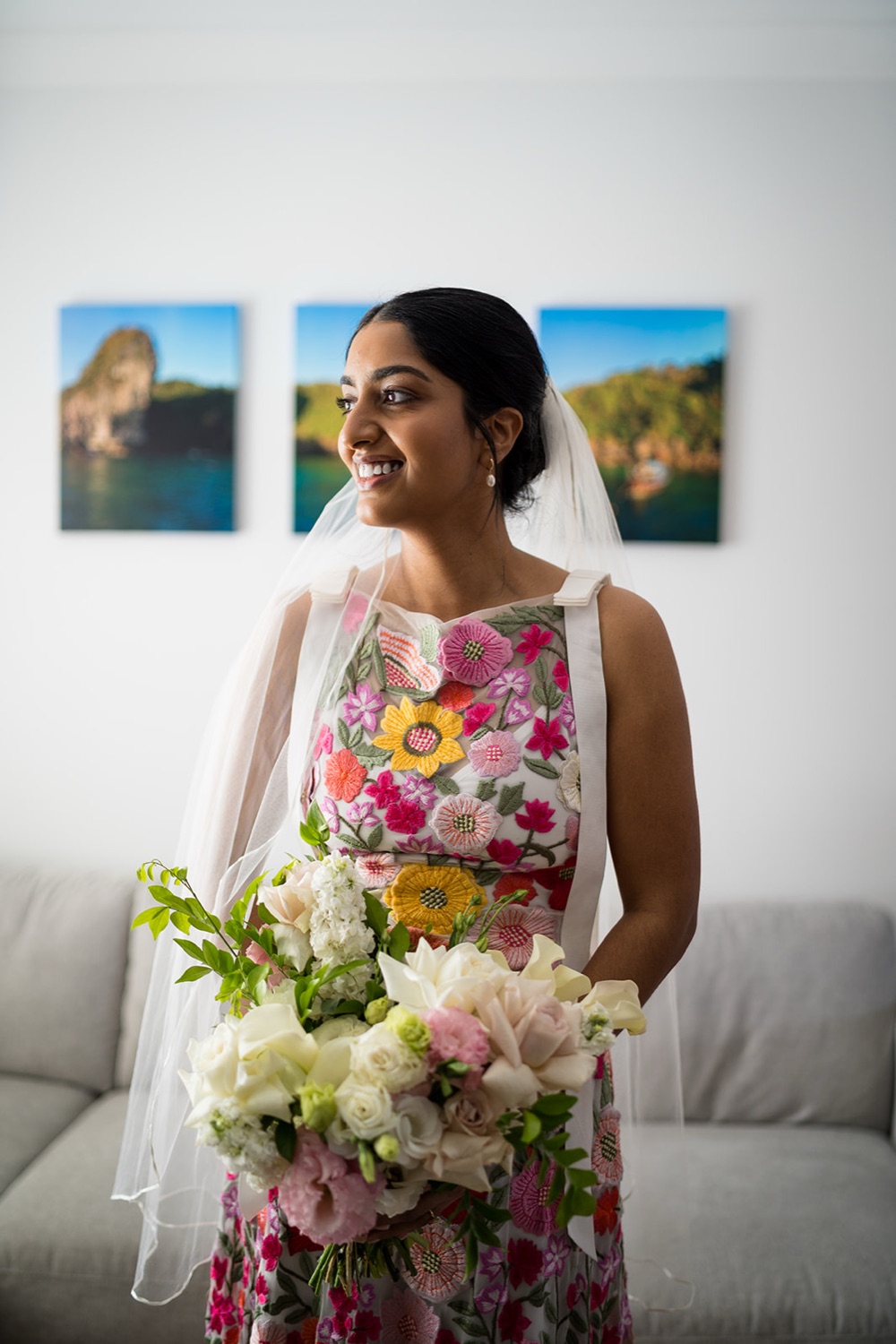 Ready with a bouquet in a floral dress. Seneli & Grayson's wedding at Lake Macquarie Yacht Club, Belmont, Newcastle