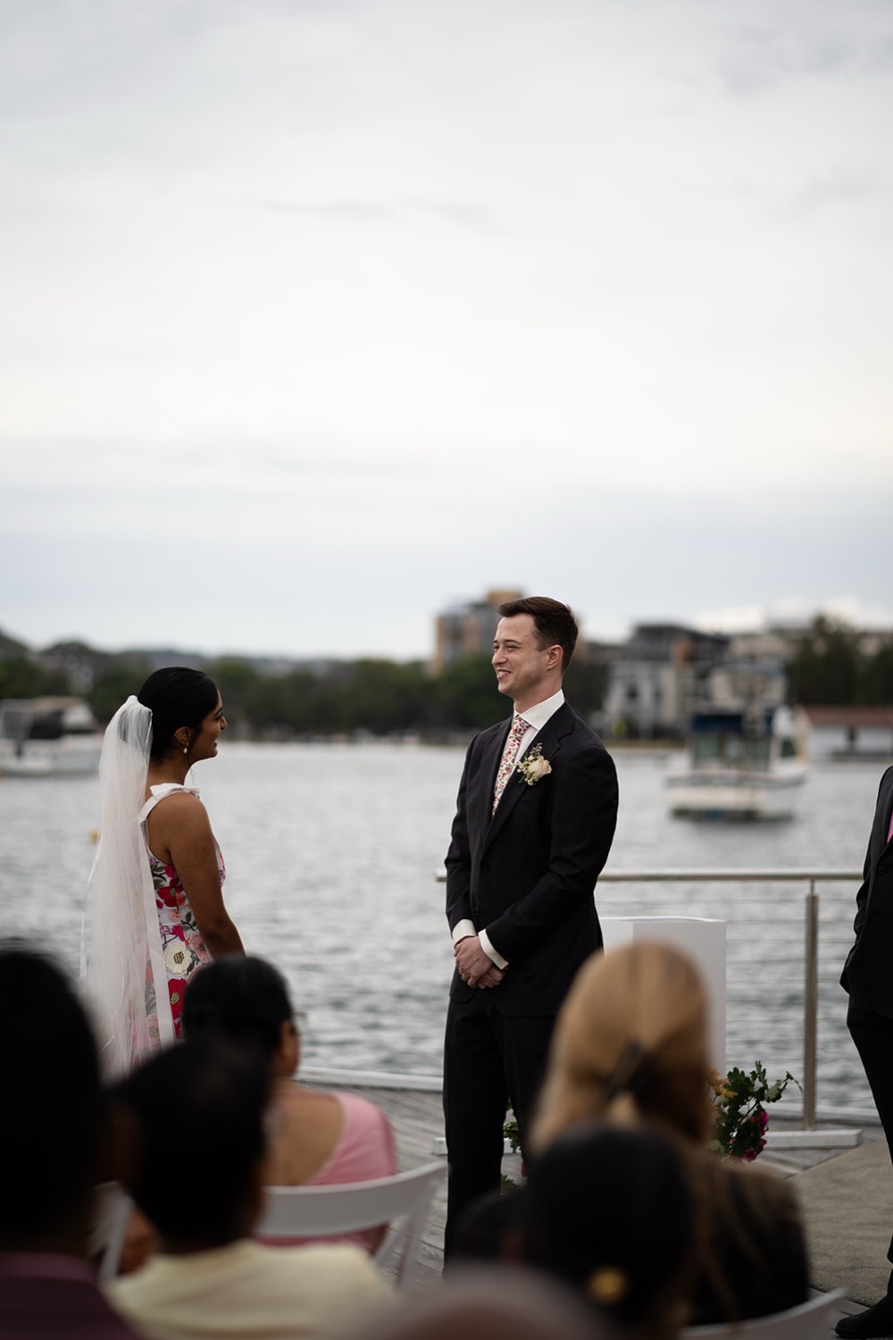 The ceremony by the lake. Seneli & Grayson's wedding at Lake Macquarie Yacht Club, Belmont, Newcastle