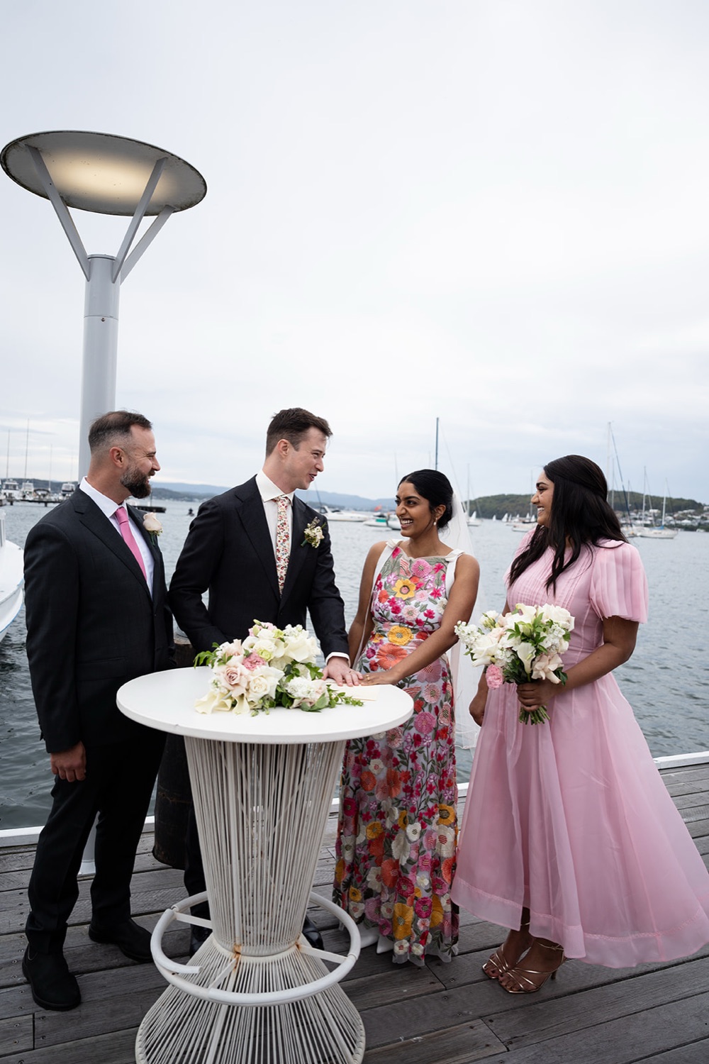 Signing the register on the deck. Seneli & Grayson's wedding at Lake Macquarie Yacht Club, Belmont, Newcastle