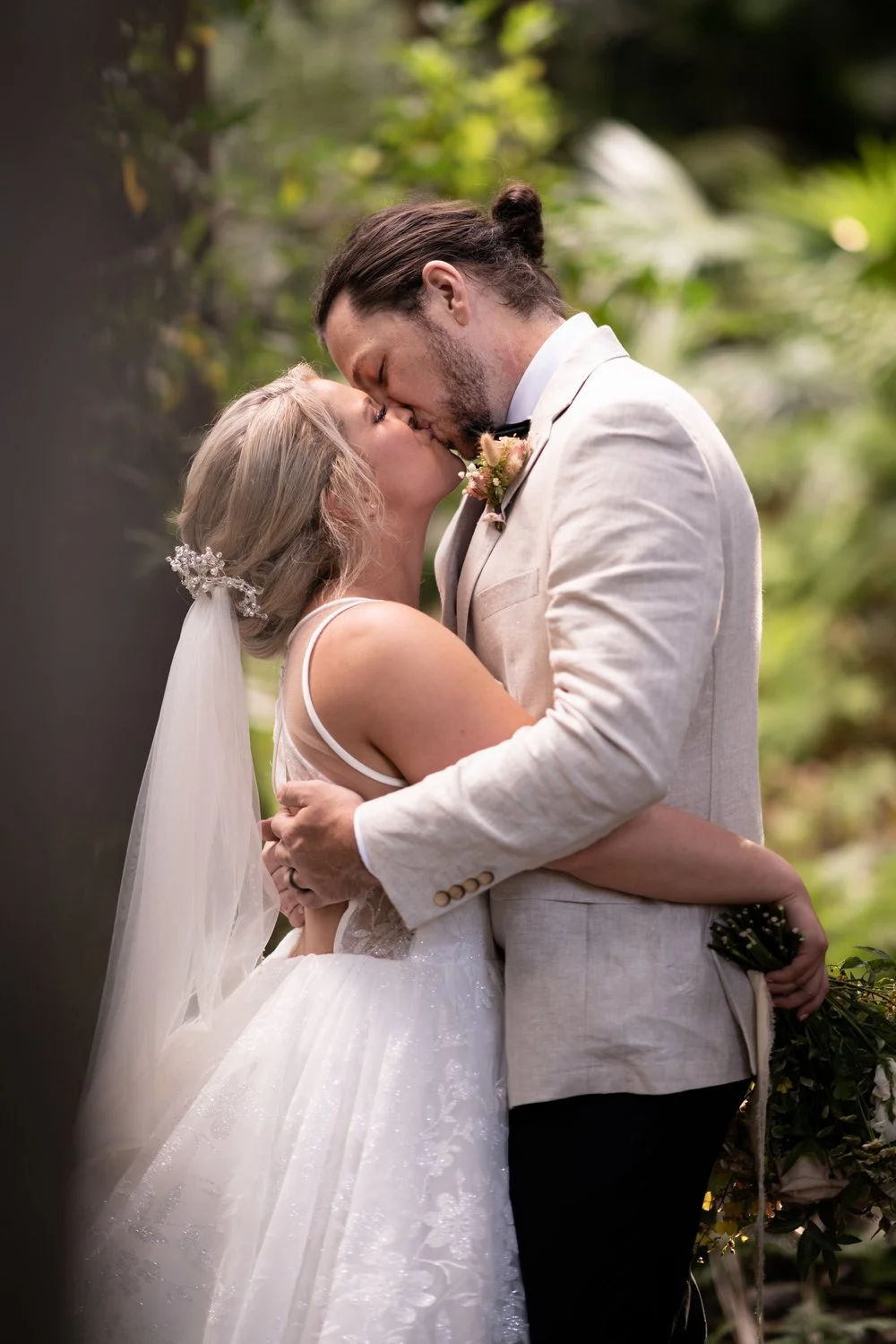 A kiss in the garden. Tamara & Sam's wedding at Kantara House, Central Coast
