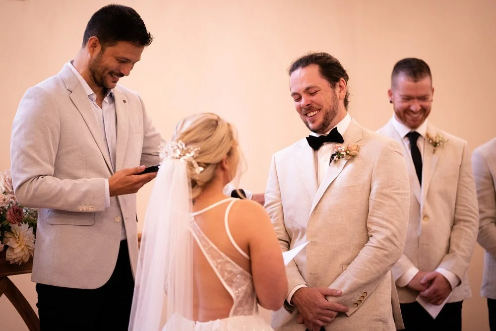 Laughing at the ceremony. Tamara & Sam's wedding at Kantara House, Central Coast