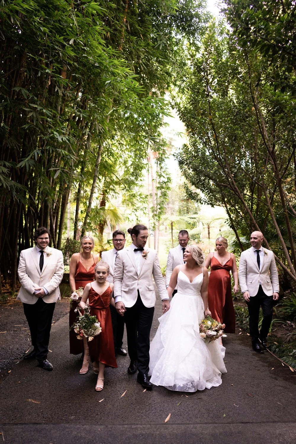 The wedding party on a garden path. Tamara & Sam's wedding at Kantara House, Central Coast
