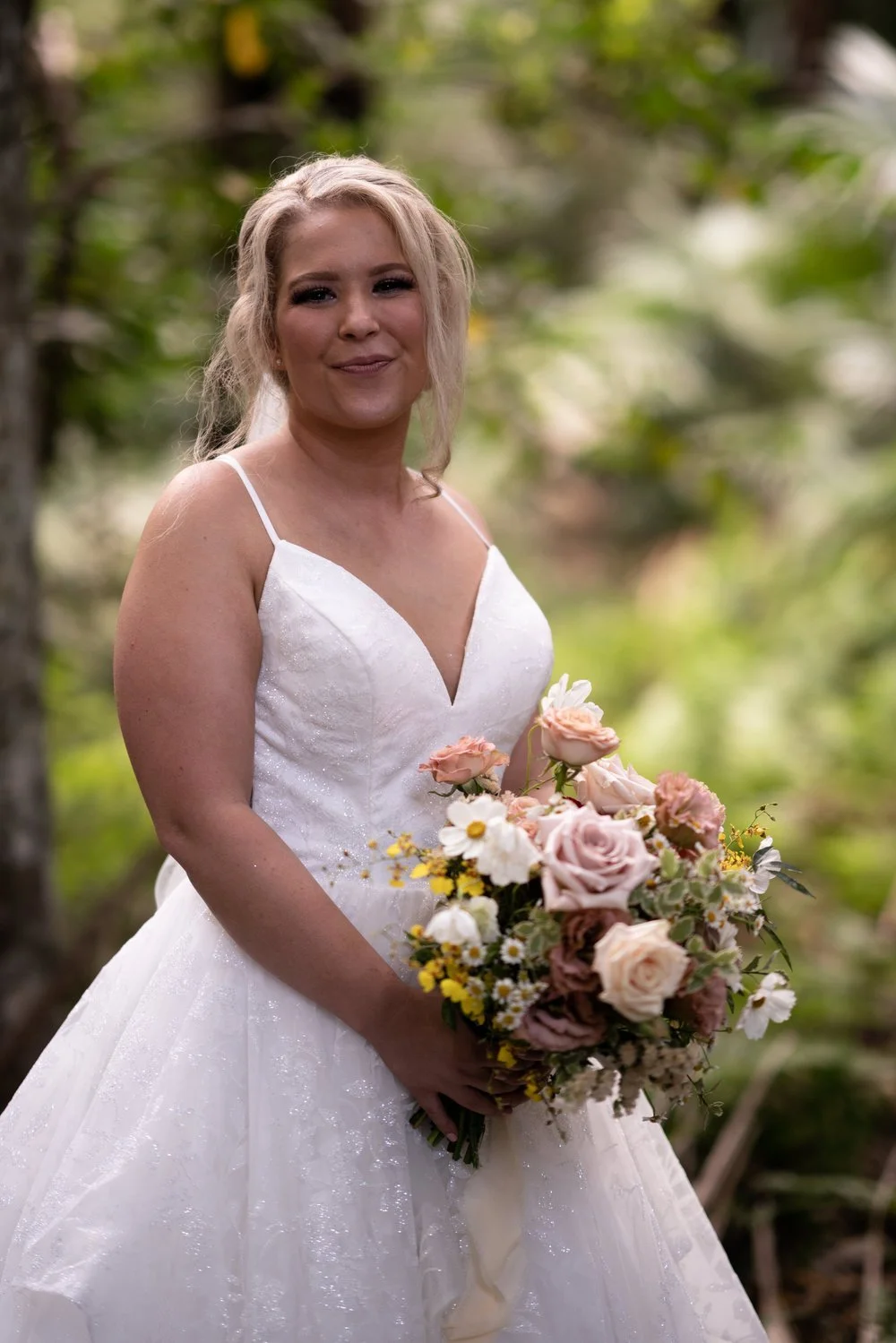 Portrait with the bouquet in the garden. Tamara & Sam's wedding at Kantara House, Central Coast