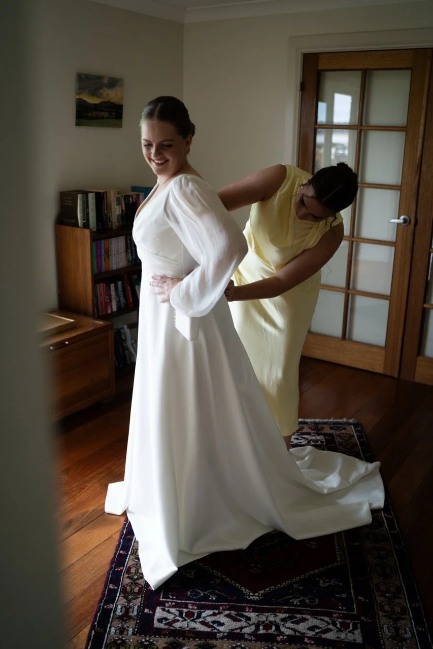 Getting into the dress. Tara & Andrew's wedding at Emerald Hill, Regional NSW