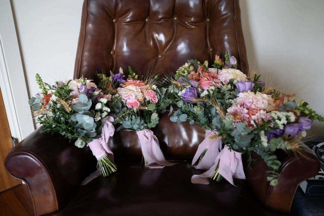 The bouquets on a leather chair. Tara & Andrew's wedding at Emerald Hill, Regional NSW