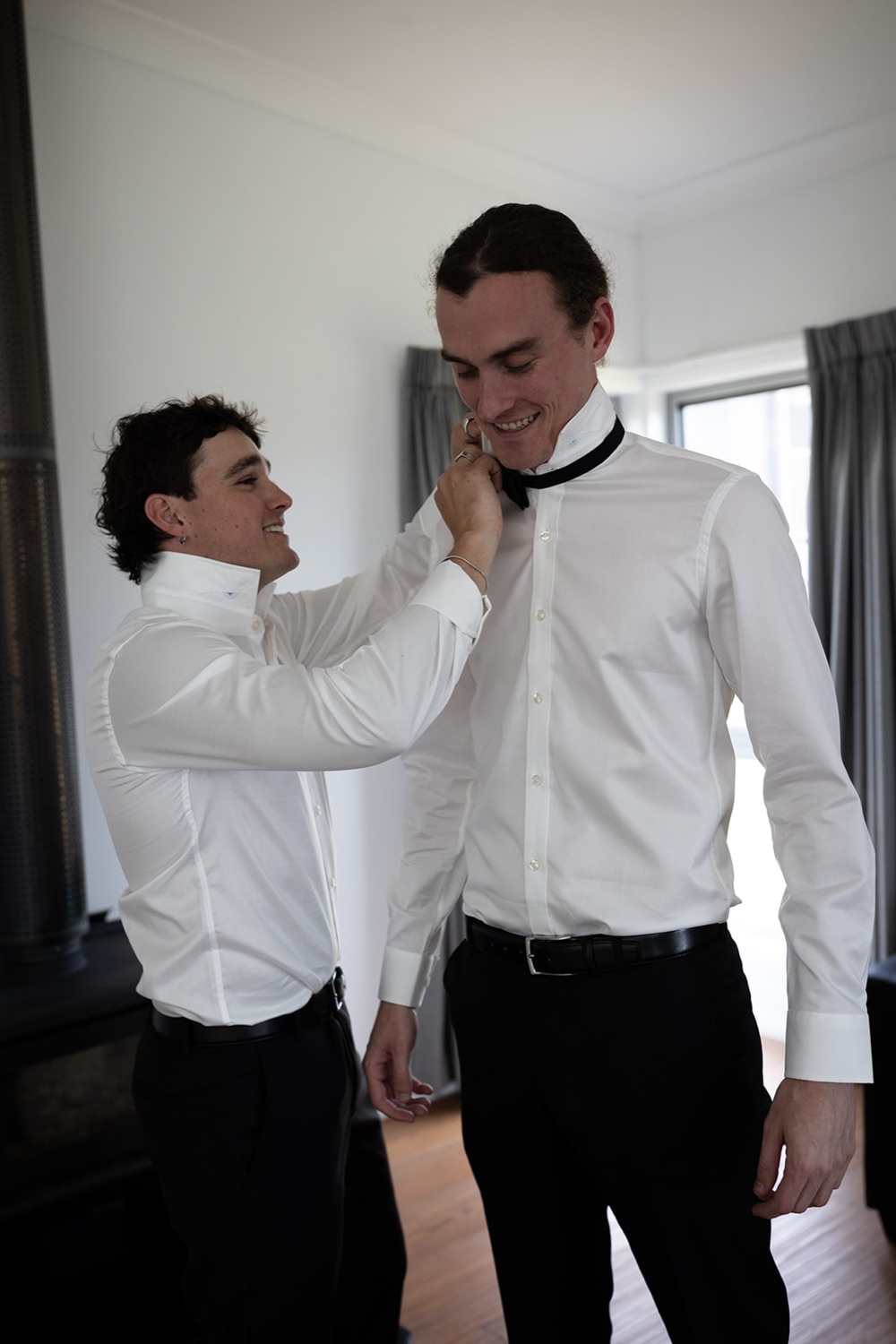 Doing up a bow tie. Tianah & Zac's wedding at White Barn, Hunter Valley