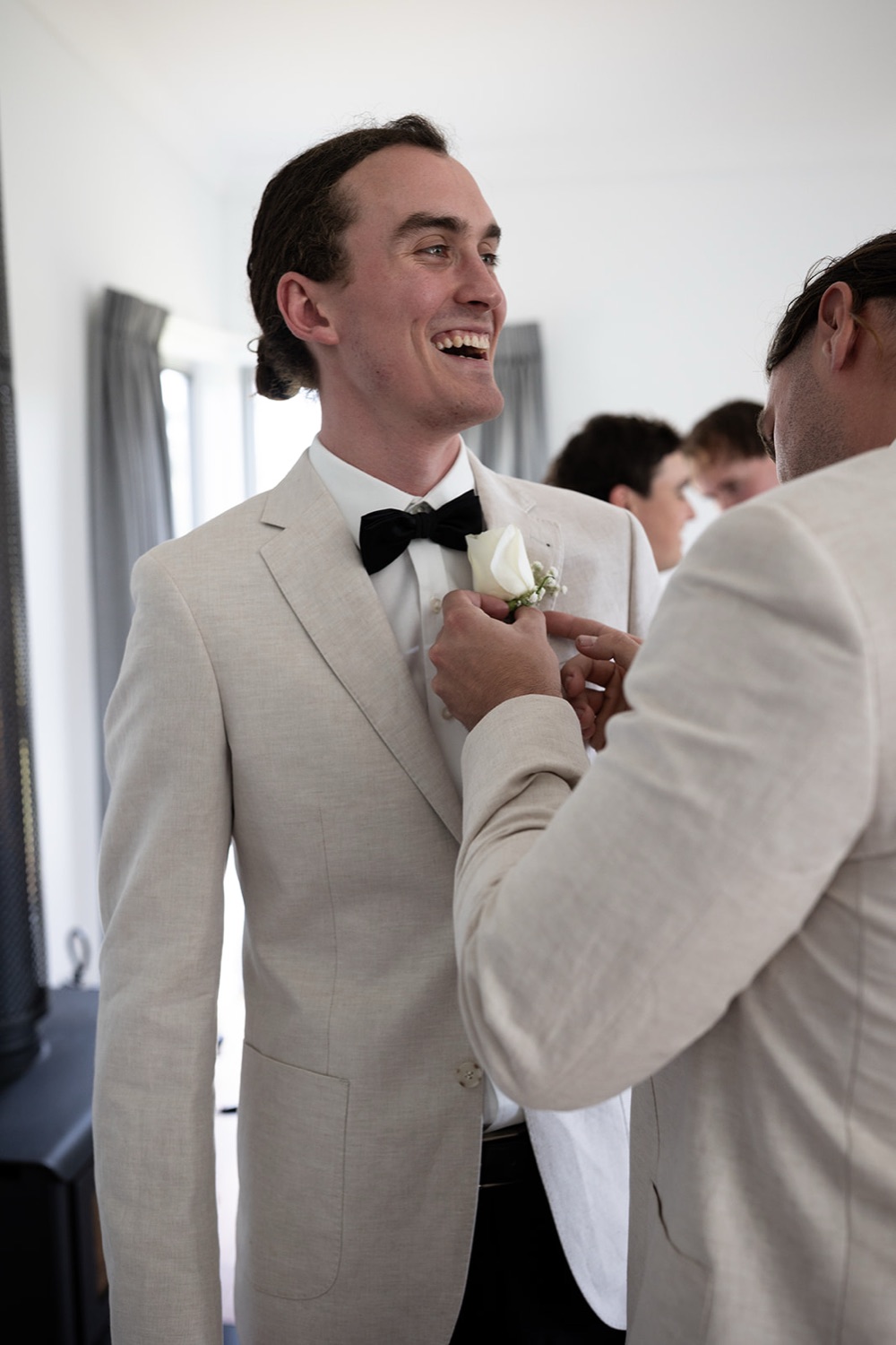 A buttonhole pinned on. Tianah & Zac's wedding at White Barn, Hunter Valley