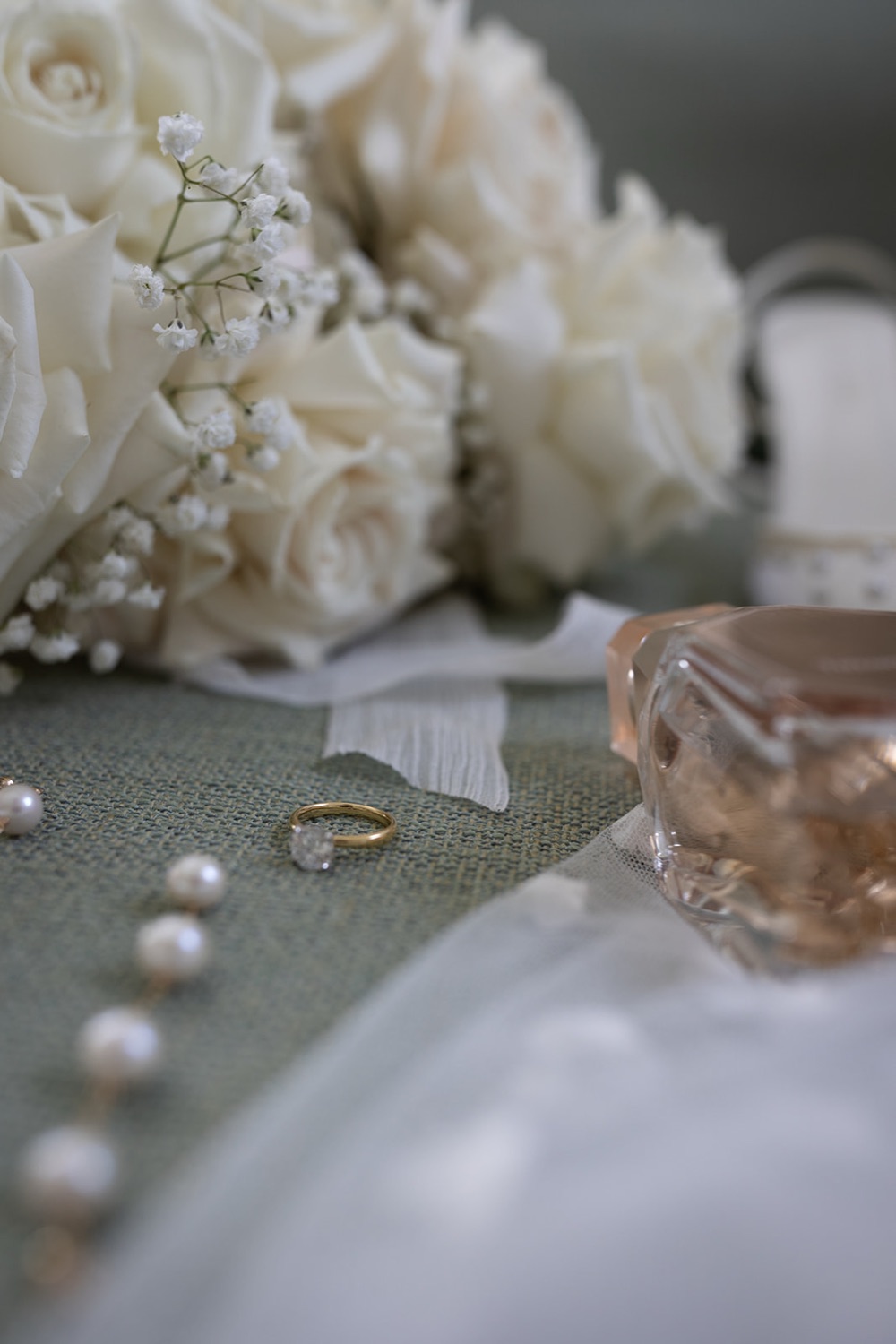 The rings beside the bouquet. Tianah & Zac's wedding at White Barn, Hunter Valley