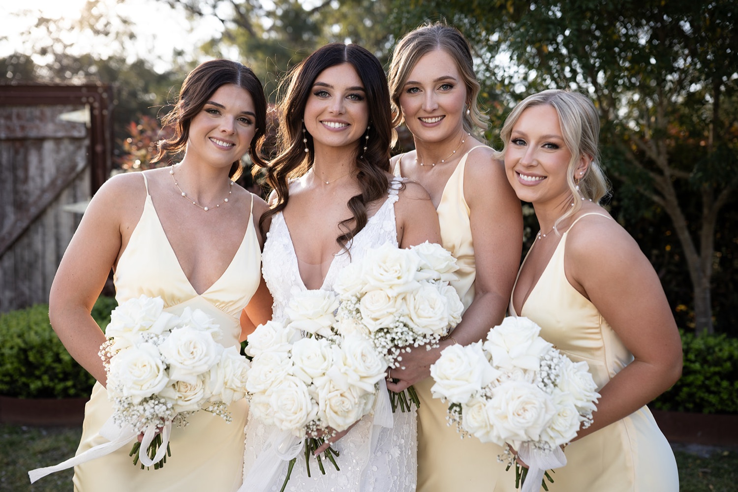 The wedding party with white bouquets. Tianah & Zac's wedding at White Barn, Hunter Valley