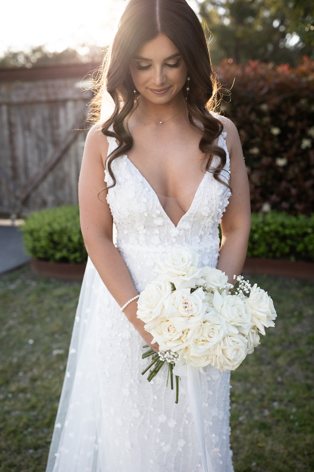 Portrait with a bouquet of white roses. Tianah & Zac's wedding at White Barn, Hunter Valley