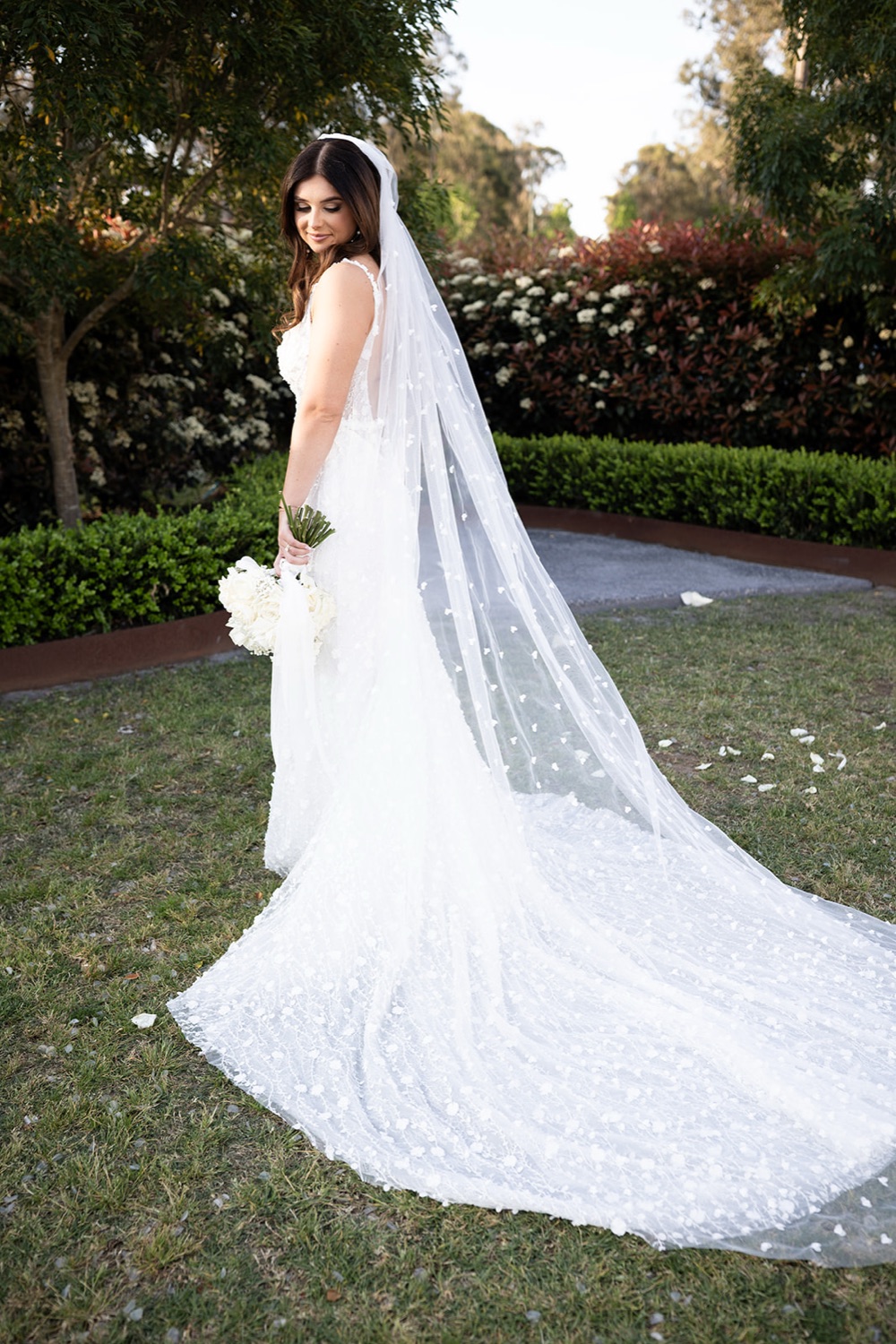 The long veil on the lawn. Tianah & Zac's wedding at White Barn, Hunter Valley