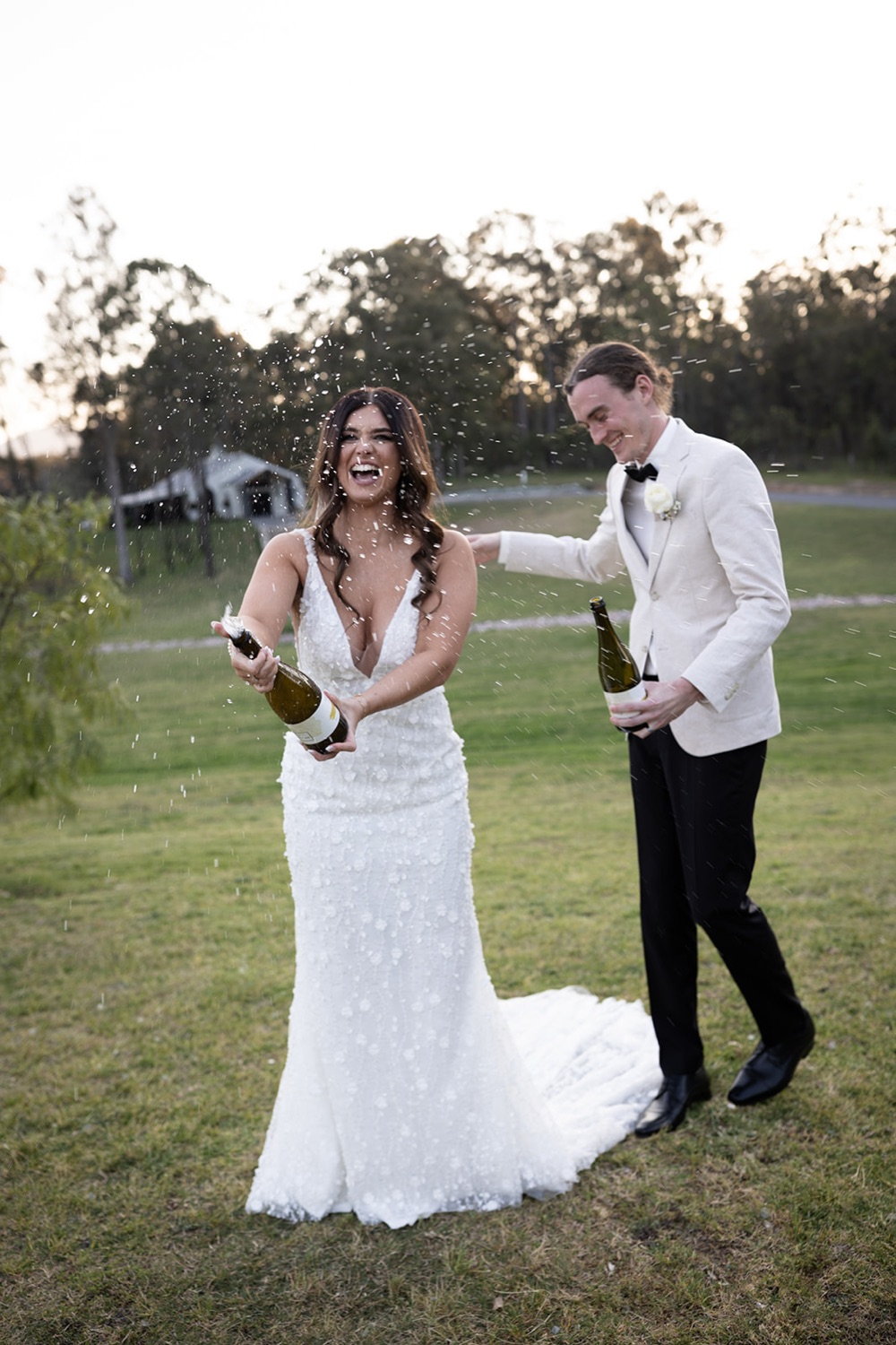 Walking across the lawn at golden hour. Tianah & Zac's wedding at White Barn, Hunter Valley