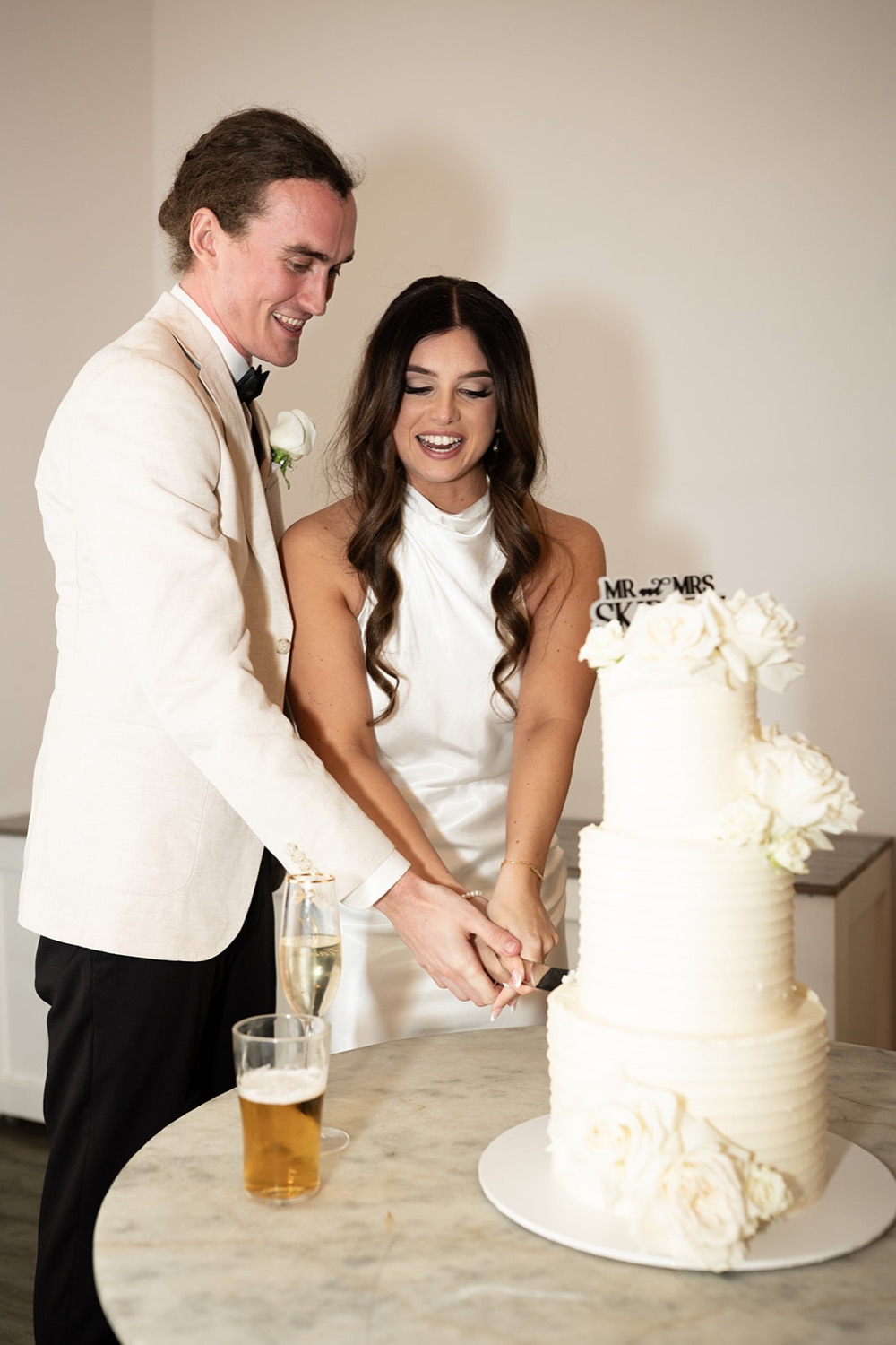 Cutting the cake. Tianah & Zac's wedding at White Barn, Hunter Valley