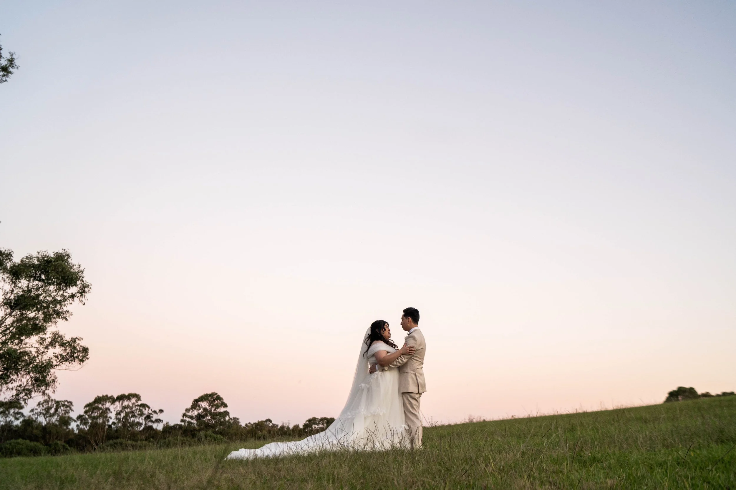The couple on a hill at sunset