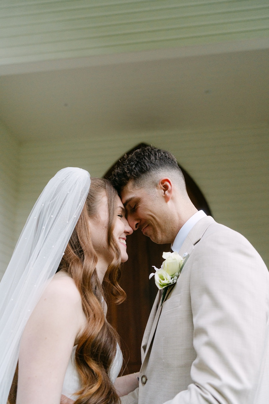 Forehead to forehead under the veil. Charlie & Lachlan's wedding at Kantara House, Central Coast
