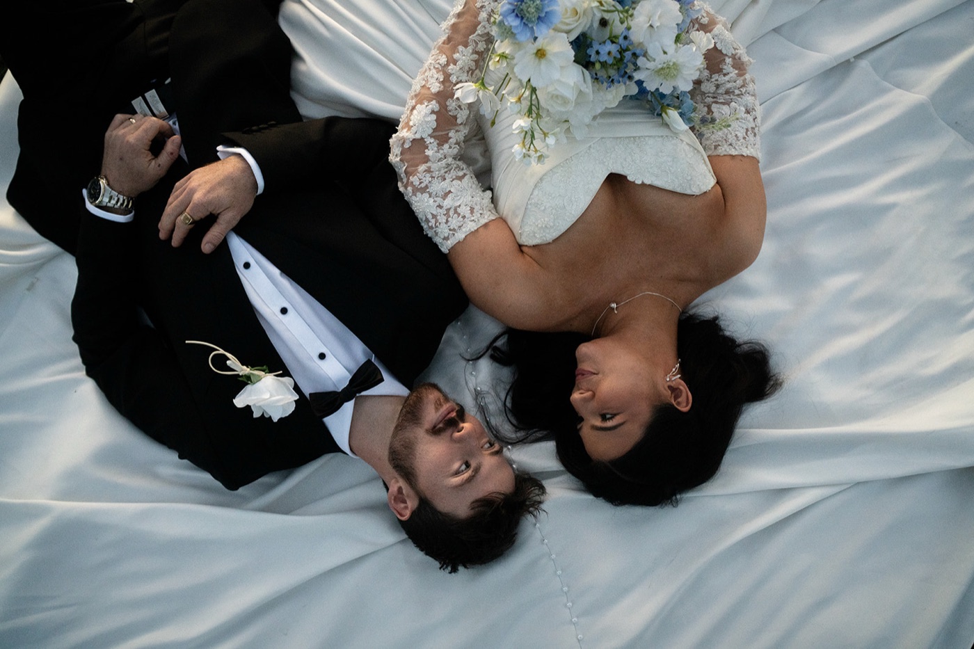Lying in the grass with the dress spread out. Isabelle & Aidan's wedding at Enzo, Hunter Valley