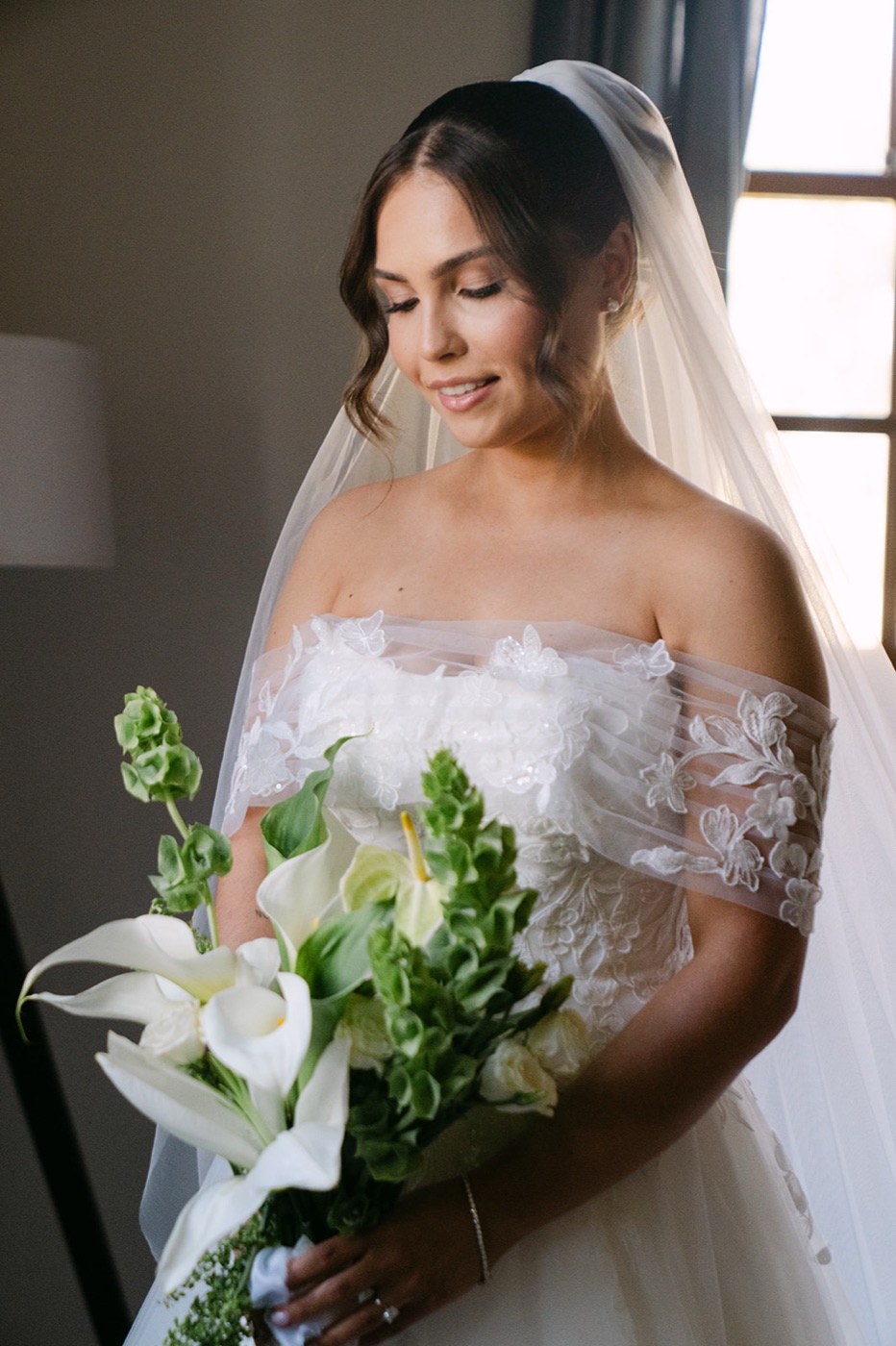 Portrait with the bouquet in an off-the-shoulder dress. Jessie & Jack's wedding at Enzo, Hunter Valley