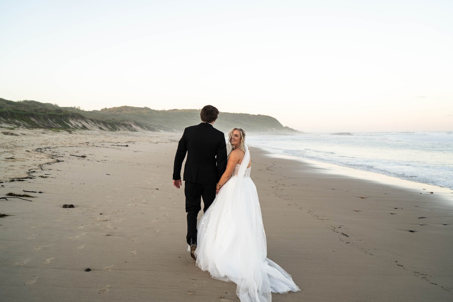 Walking on the beach at sunrise. 's wedding at unknown, unknown