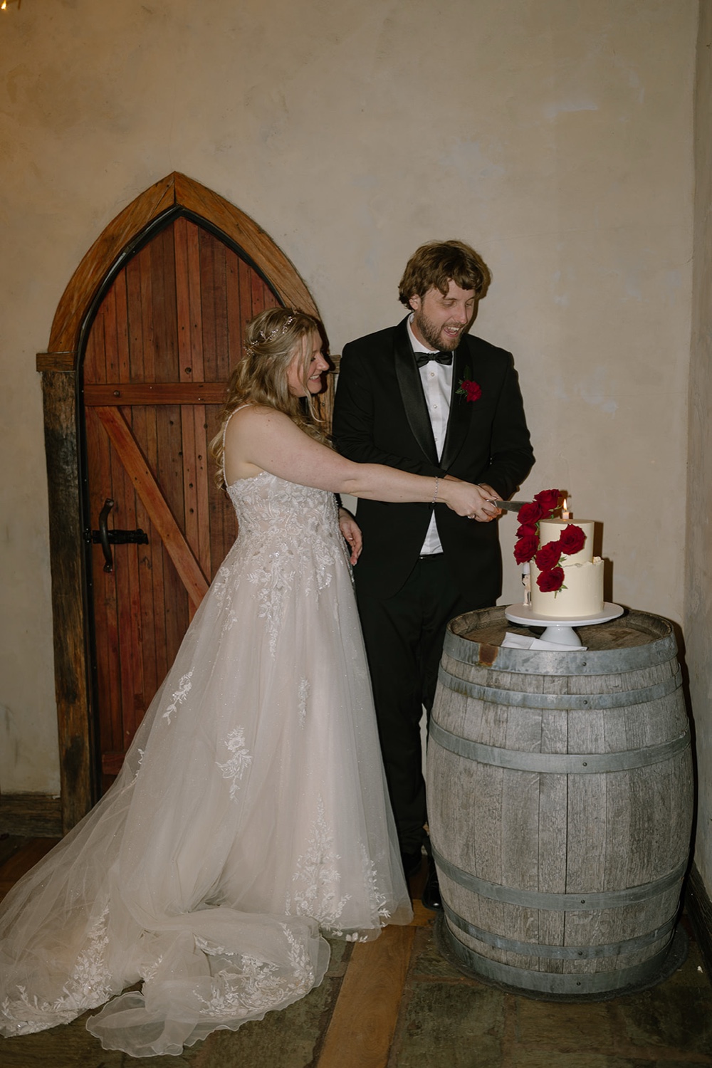 Chris and Casey cutting their wedding cake