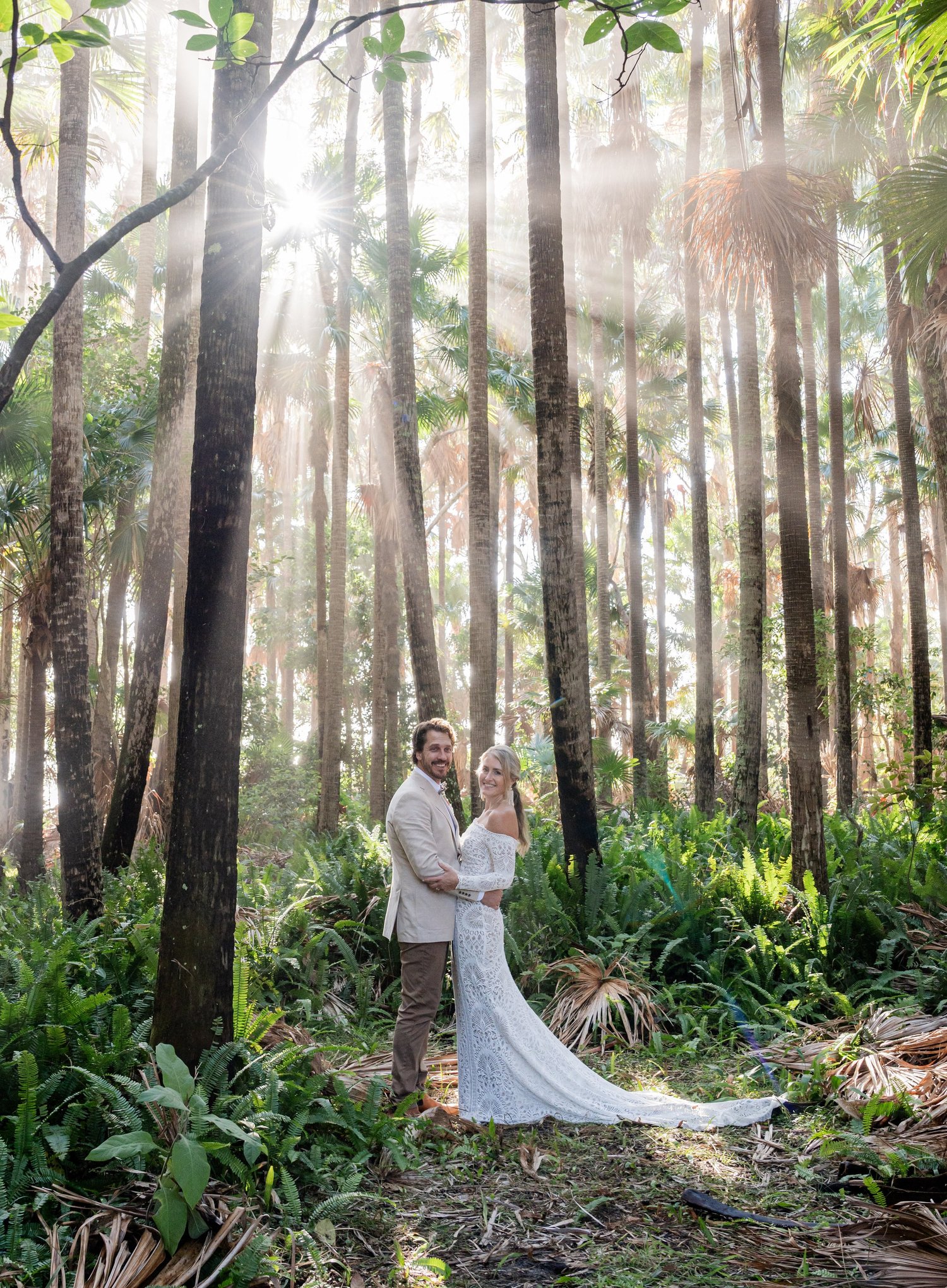 The couple in the forest with sun rays. 's wedding at unknown, unknown
