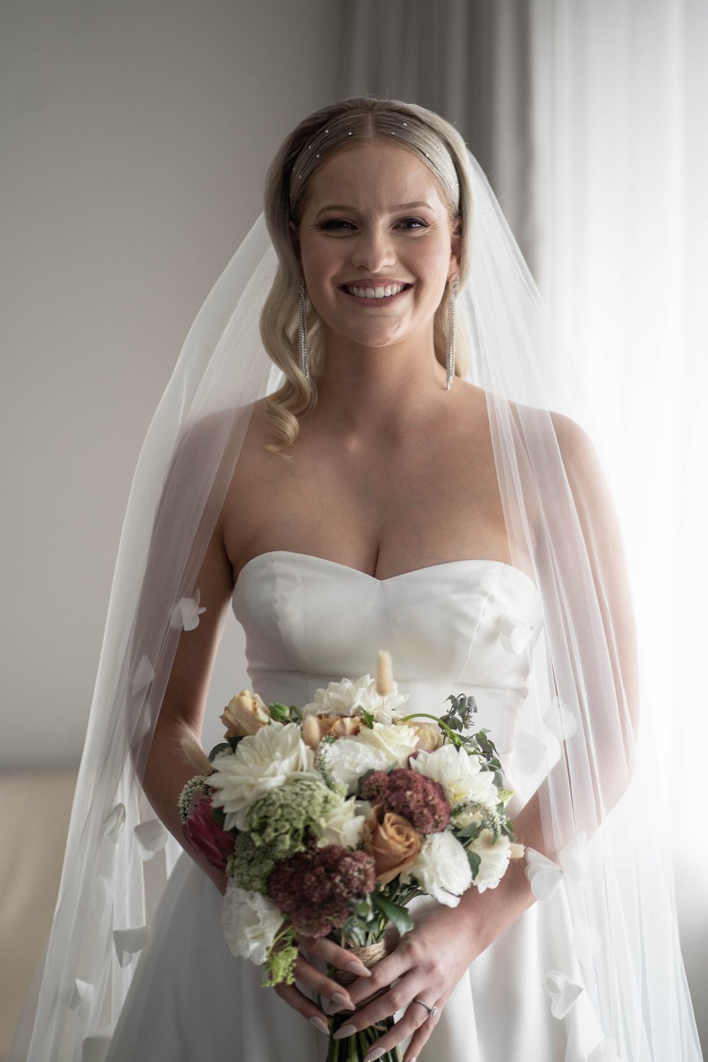 Portrait with the bouquet by the window